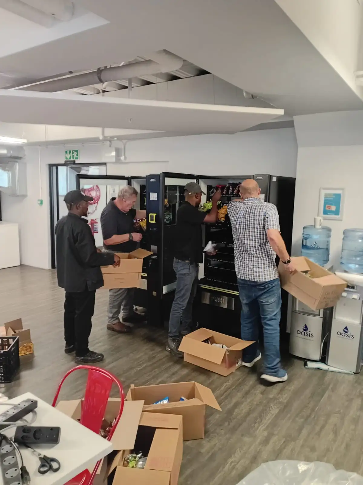 The IVS team unpacking and setting up stock with a client